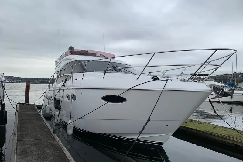 The Image of 2019 Princess F49 yacht docked at a marina on a cloudy day. - 0