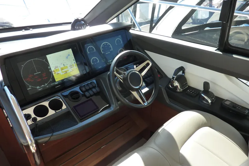 Slide: The Image of Helm of 2019 Princess F49 yacht with advanced navigation displays and controls. - 17