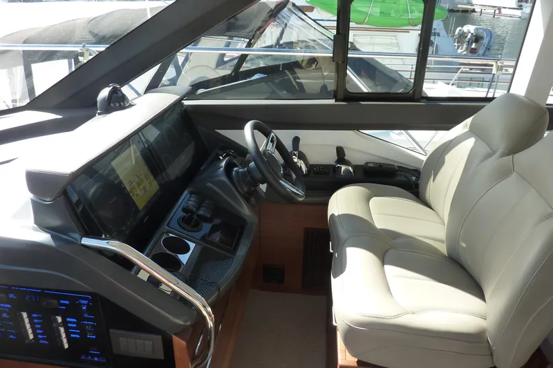 Slide: The Image of Luxurious interior of 2019 Princess F49 yacht with modern helm and comfortable seating. - 18