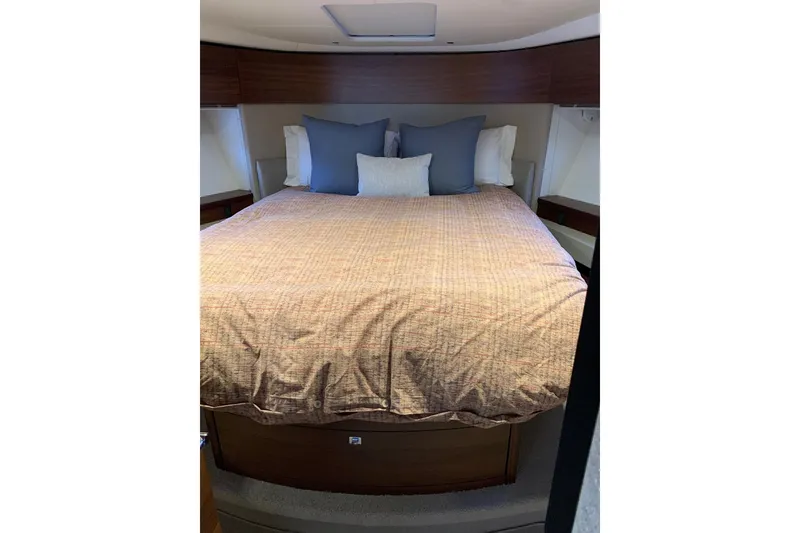 Slide: The Image of Luxurious bedroom interior of 2019 Princess F49 yacht with cozy bedding and pillows. - 20