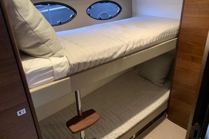 Slide: The Image of Bunk beds in 2019 Princess F49 yacht cabin with porthole windows. - 22