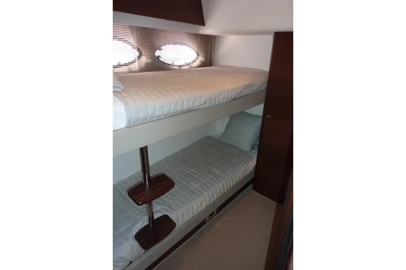 Slide: The Image of Bunk beds in 2019 Princess F49 yacht cabin, featuring sleek design and comfortable bedding. - 23