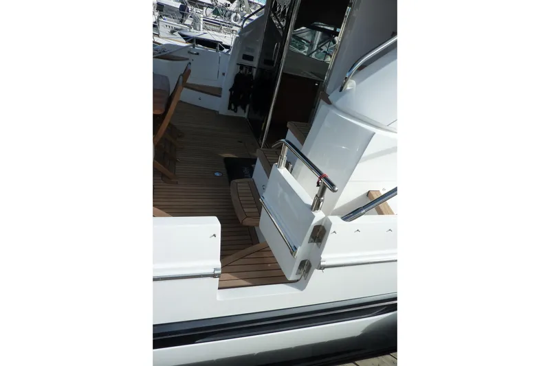 Slide: The Image of 2019 Princess F49 yacht with teak deck and stainless steel railings. - 5