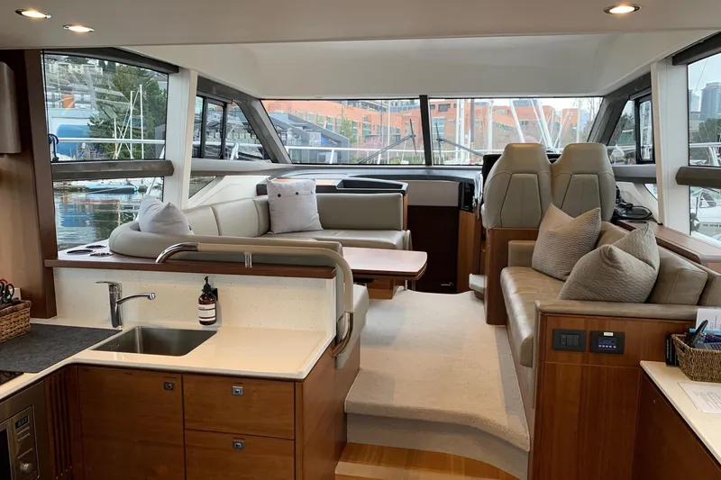Slide: The Image of Luxurious interior of 2019 Princess F49 yacht with modern seating and kitchenette. - 8