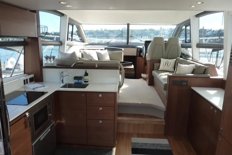 Slide: The Image of Luxurious interior of 2019 Princess F49 yacht with modern kitchen and seating area. - 9