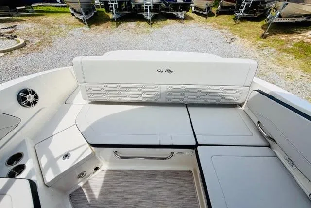 Slide: The Image of 2025 Sea Ray SPX 210 boat interior with white seating and modern design. - 10