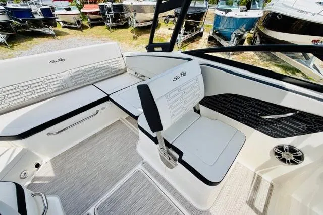 Slide: The Image of Interior of 2025 Sea Ray SPX 210 boat with white seating and modern design. - 11