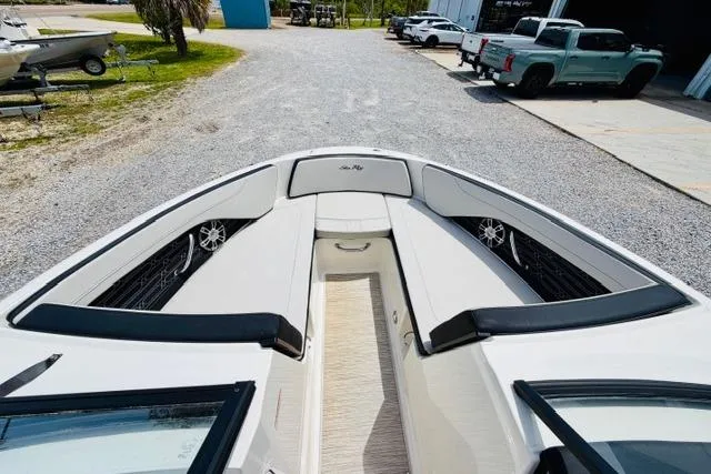Slide: The Image of 2025 Sea Ray SPX 210 boat interior with spacious seating and modern design. - 14
