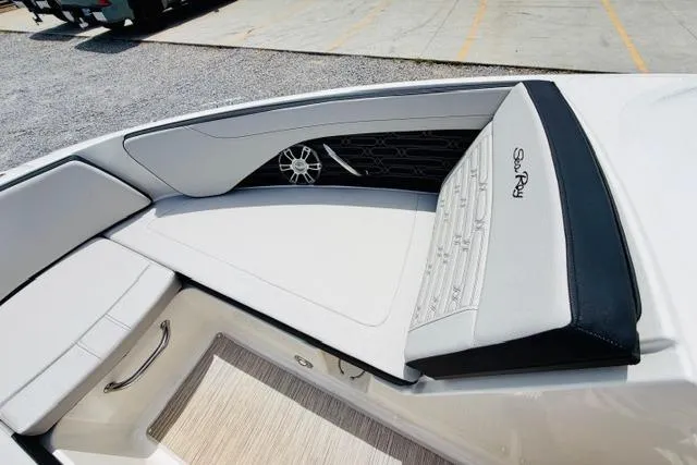 Slide: The Image of 2025 Sea Ray SPX 210 boat interior with sleek seating and stylish design. - 15