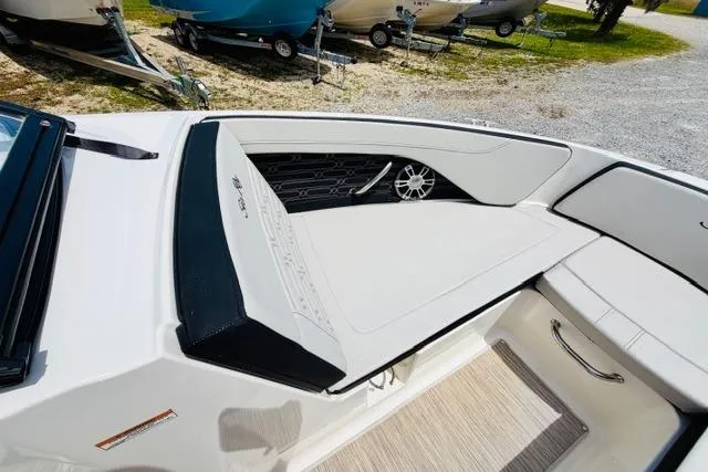 Slide: The Image of 2025 Sea Ray SPX 210 boat interior with sleek seating and modern design. - 16