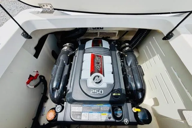 Slide: The Image of Engine compartment of 2025 Sea Ray SPX 210 boat, featuring a 4.5L 250 horsepower engine. - 18