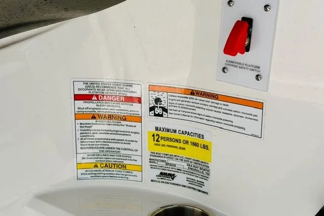 Slide: The Image of Safety and capacity labels on 2025 Sea Ray SPX 210 boat, indicating 12-person limit. - 21