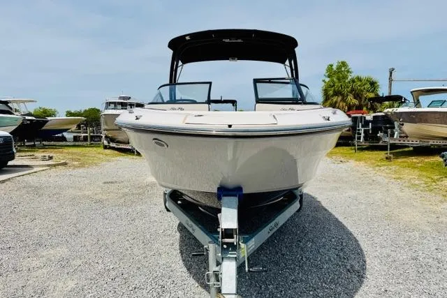 Slide: The Image of 2025 Sea Ray SPX 210 boat on trailer, displayed outdoors. - 6
