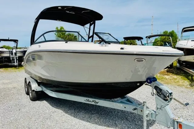 Slide: The Image of 2025 Sea Ray SPX 210 boat on trailer, displayed outdoors. - 7