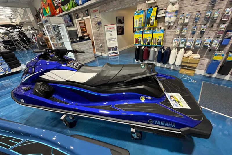 Slide: The Image of 2024 Yamaha WaveRunner GP1800R SVHO in showroom, blue and black design, displayed with accessories. - 13
