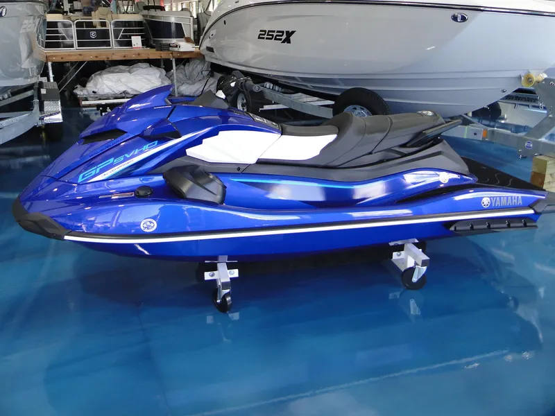 Slide: The Image of 2024 Yamaha Boats GP SVHO in blue on display in a showroom. - 3