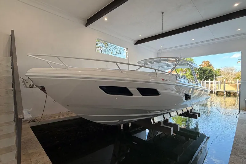 The Image of 2024 Intrepid 41 Valor boat in indoor dock, side view. - 0