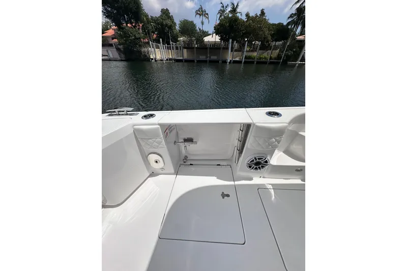 Slide: The Image of 2024 Intrepid 41 Valor boat deck with water view and seating area. - 10