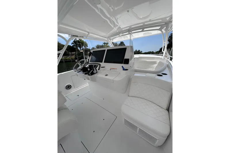Slide: The Image of 2024 Intrepid 41 Valor boat interior with modern helm and seating. - 13