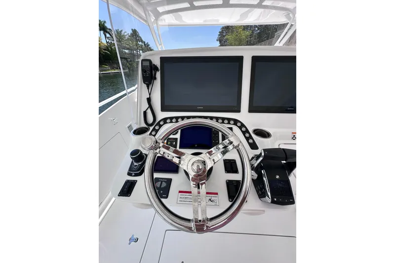 Slide: The Image of 2024 Intrepid 41 Valor helm with dual screens and modern controls. - 14