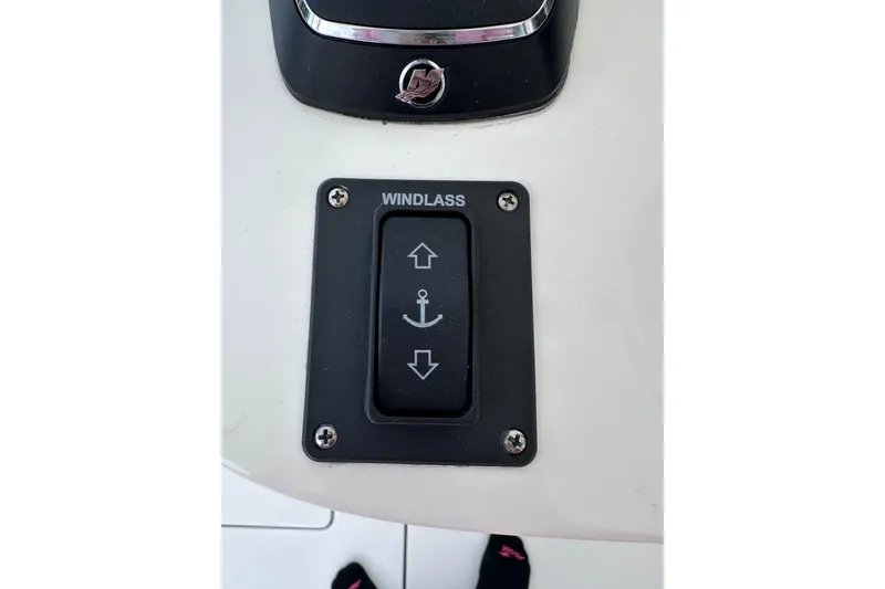Slide: The Image of Windlass control switch on 2024 Intrepid 41 Valor boat dashboard. - 16