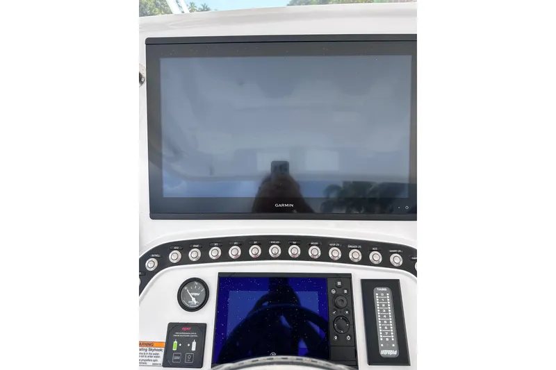 Slide: The Image of 2024 Intrepid 41 Valor dashboard featuring Garmin display and control panel. - 20