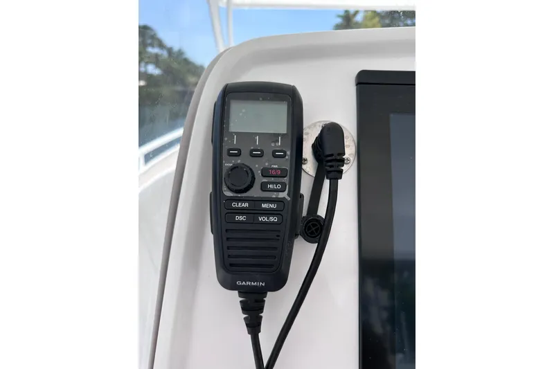 Slide: The Image of Garmin marine radio on 2024 Intrepid 41 Valor boat dashboard. - 21