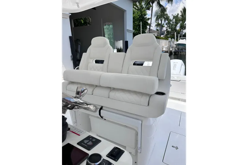 Slide: The Image of Luxurious seating on 2024 Intrepid 41 Valor boat, featuring plush white upholstery and modern design. - 22