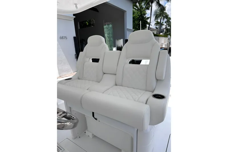 Slide: The Image of Luxurious seating on the 2024 Intrepid 41 Valor boat, featuring plush white upholstery. - 23