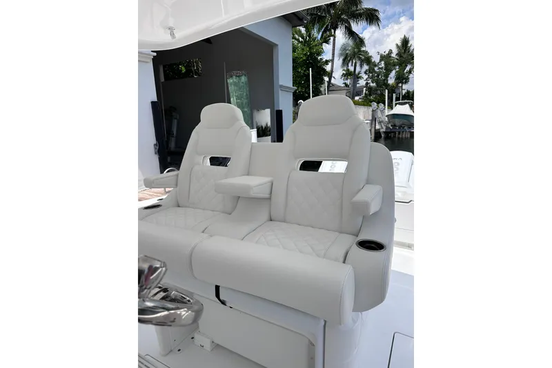 Slide: The Image of Luxurious seating on the 2024 Intrepid 41 Valor boat, featuring plush white upholstery. - 25