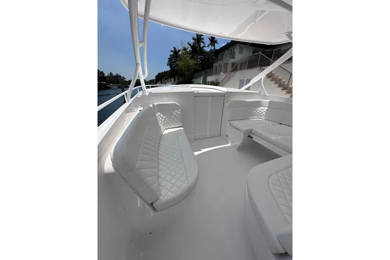 Slide: The Image of Luxurious seating area on the 2024 Intrepid 41 Valor boat, featuring elegant white upholstery. - 27