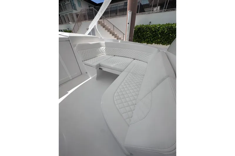 Slide: The Image of Luxurious seating area on the 2024 Intrepid 41 Valor boat, featuring quilted upholstery. - 28