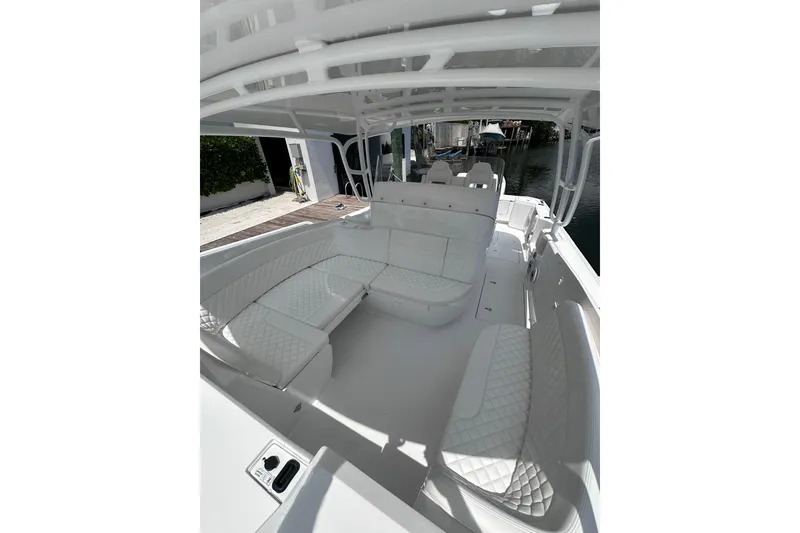 Slide: The Image of Luxurious interior of 2024 Intrepid 41 Valor boat with white seating and sleek design. - 30