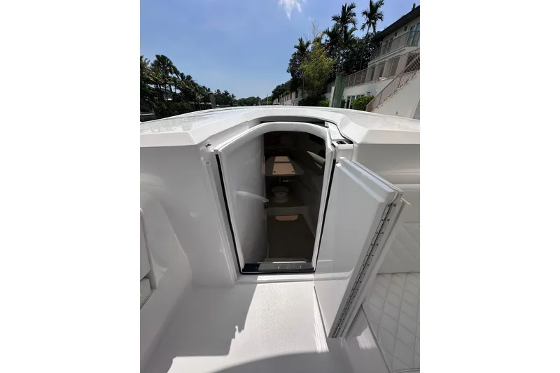 Slide: The Image of 2024 Intrepid 41 Valor boat cabin entrance with open door, showcasing interior space. - 32