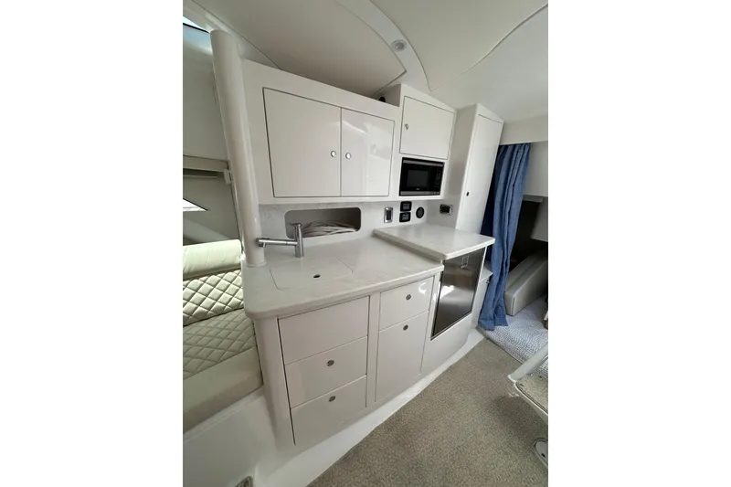 Slide: The Image of Luxurious interior of 2024 Intrepid 41 Valor yacht featuring modern kitchenette and sleek cabinetry. - 33