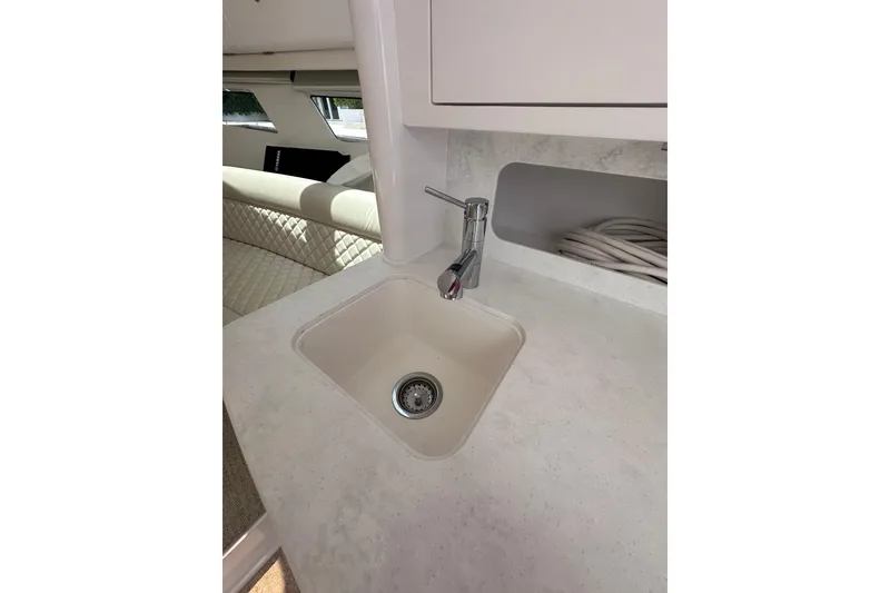 Slide: The Image of Modern sink area in 2024 Intrepid 41 Valor yacht interior. - 35
