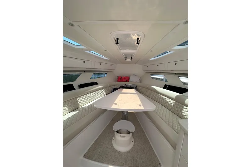 Slide: The Image of Luxurious interior of 2024 Intrepid 41 Valor yacht with elegant seating and table. - 36
