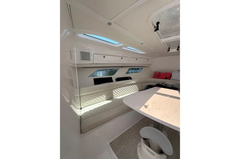 Slide: The Image of Luxurious interior of 2024 Intrepid 41 Valor yacht with elegant seating and table. - 37