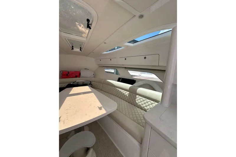 Slide: The Image of Luxurious interior of 2024 Intrepid 41 Valor yacht with elegant seating and table. - 38