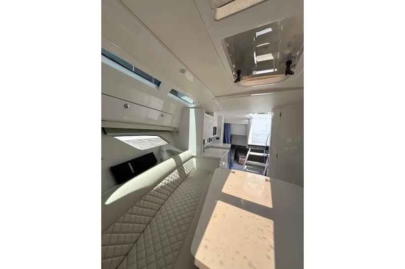 Slide: The Image of Luxurious interior of 2024 Intrepid 41 Valor boat, featuring elegant seating and modern design. - 42