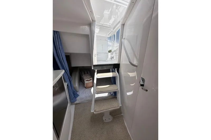 Slide: The Image of Interior view of 2024 Intrepid 41 Valor yacht, featuring stairs and modern design elements. - 46