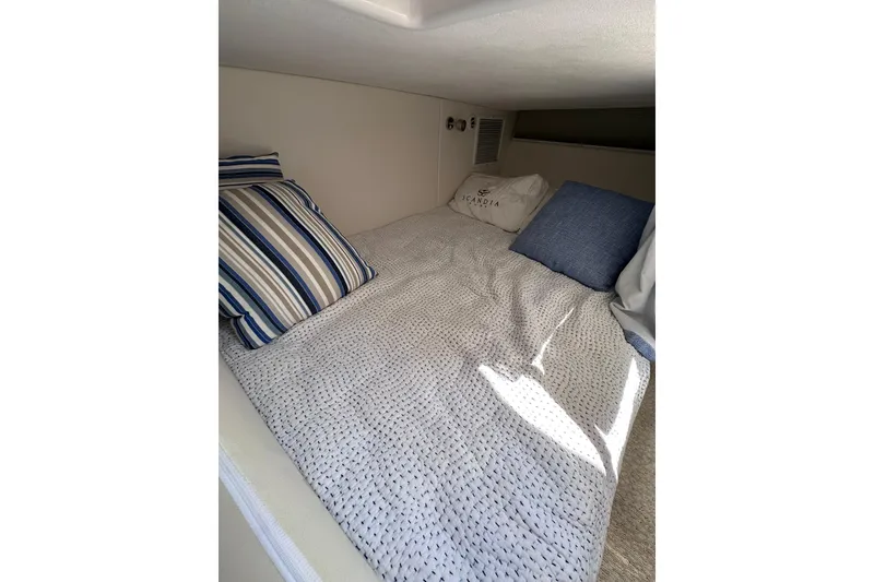 Slide: The Image of Cozy cabin bed with striped pillows in 2024 Intrepid 41 Valor yacht. - 47