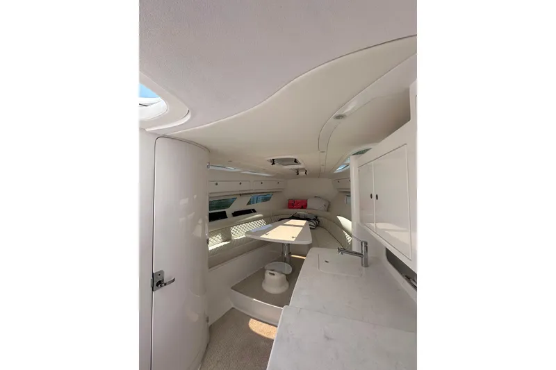 Slide: The Image of Interior of 2024 Intrepid 41 Valor yacht, featuring sleek white design and modern amenities. - 51