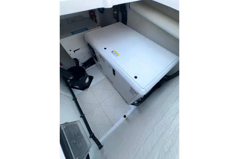 Slide: The Image of Engine compartment of 2024 Intrepid 41 Valor boat, showcasing equipment and wiring. - 52