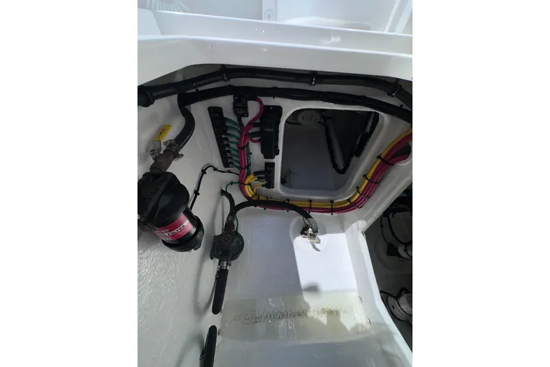 Slide: The Image of 2024 Intrepid 41 Valor boat wiring and mechanical components in a white compartment. - 54