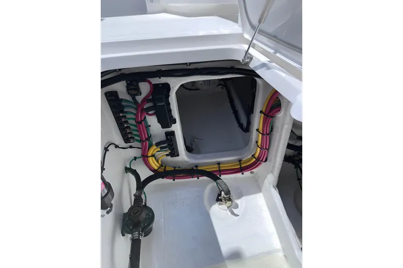 Slide: The Image of 2024 Intrepid 41 Valor boat wiring compartment with organized cables and connectors. - 55
