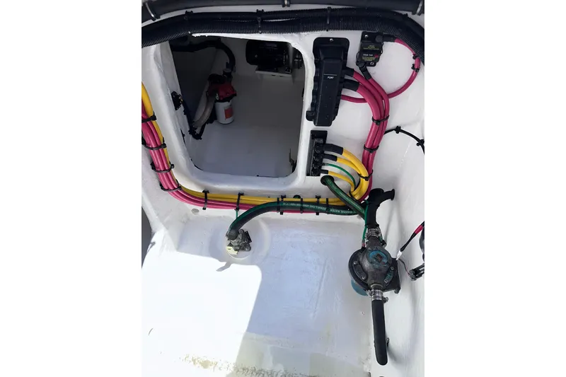 Slide: The Image of 2024 Intrepid 41 Valor boat interior wiring and components, showcasing organized cables and equipment. - 56