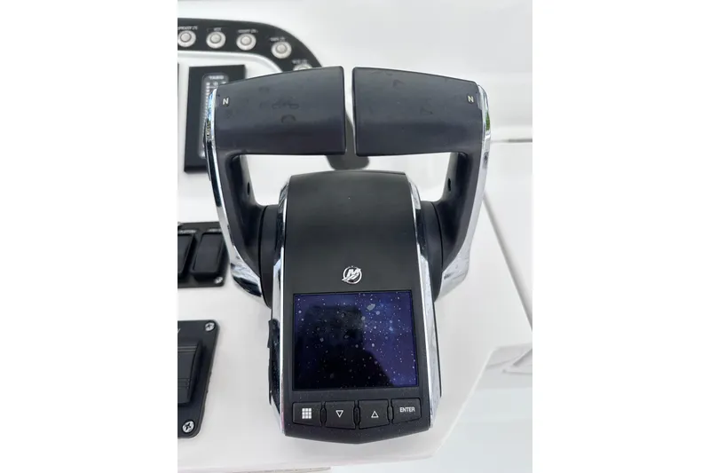 Slide: The Image of Throttle control panel of 2024 Intrepid 41 Valor boat, featuring modern design and digital display. - 59