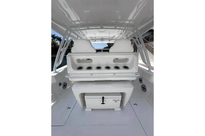 Slide: The Image of 2024 Intrepid 41 Valor boat interior with white seating and storage compartments. - 6