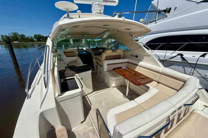 Slide: The Image of Luxurious 2012 Sea Ray 410 Sundancer yacht interior with spacious seating and elegant design. - 10